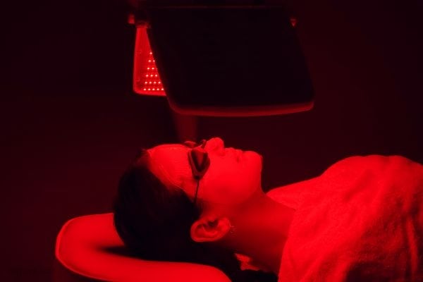 Woman having a red light therapy session