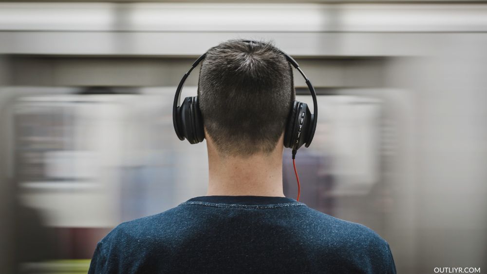 A man in the subway with his heaphones on