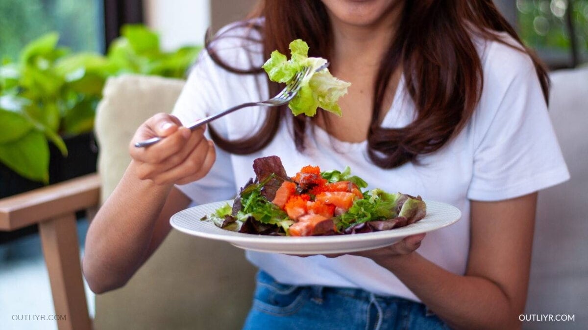 Woman having a plate of salad