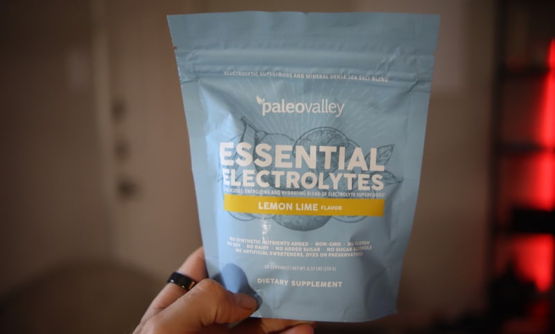 Nick Urban holding a pouch of Paleovalley Essential Electrolytes 