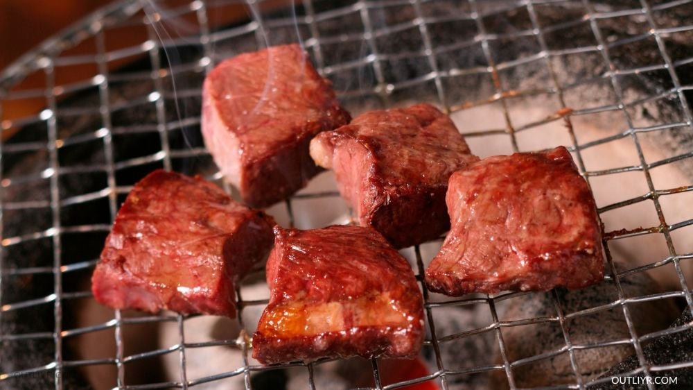 Beef heart getting cooked in a barbeque